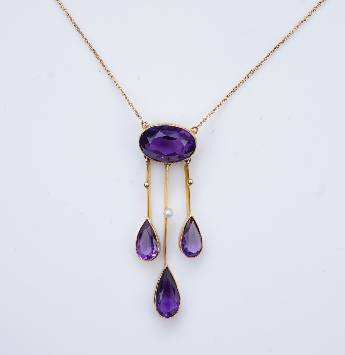 An Edwardian amethyst and seed pearl pendant, circa 1910